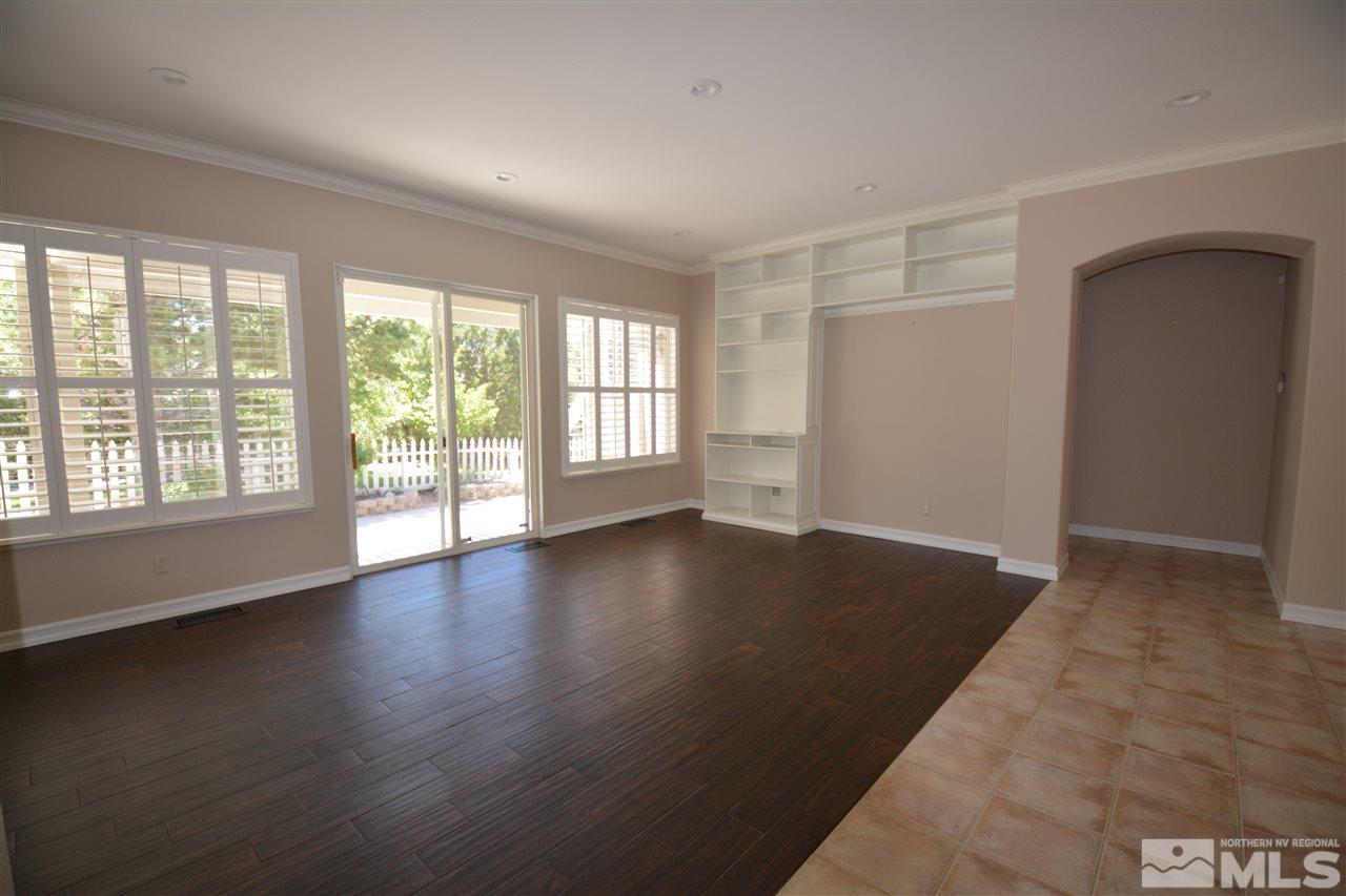 1715 Hunter Creek Road Reno, NV 89519 - Photo 8 of 40 wooden floor in an empty room with a window