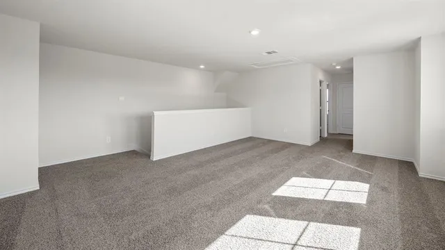 a view of empty room with windows