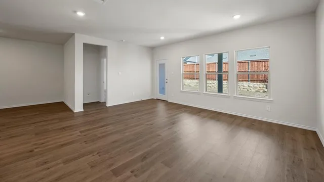 a view of kitchen with refrigerator microwave and stove
