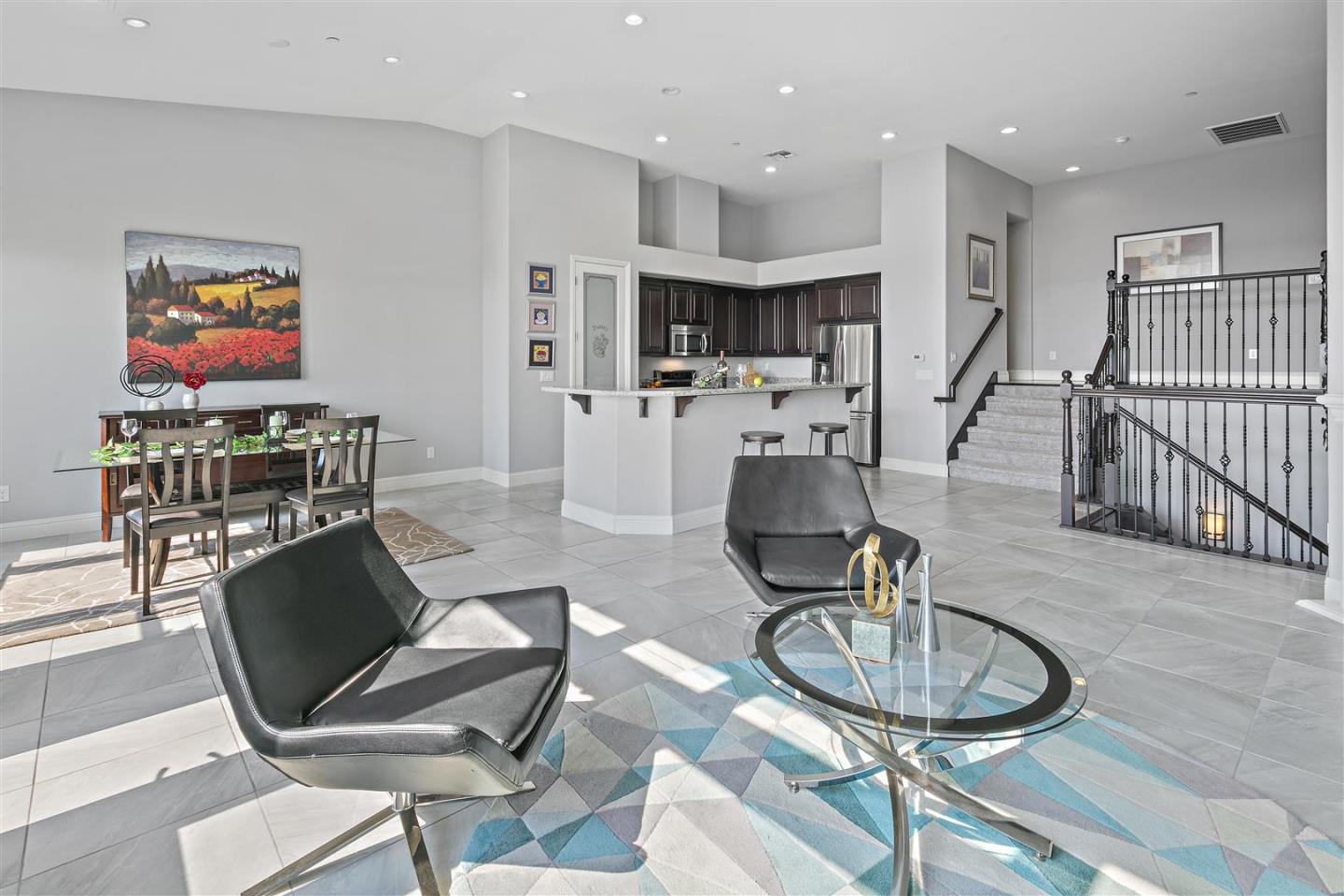 Oakland, 94605 - Photo 20 of 61 a living room with furniture a dining table and kitchen view