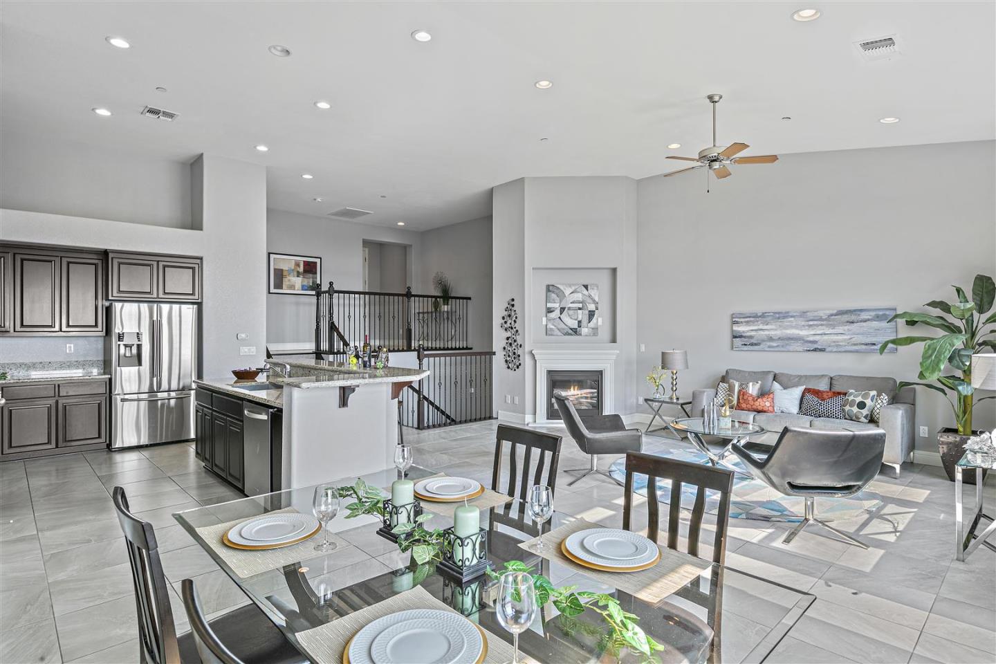 Oakland, 94605 - Photo 22 of 61 a open dining room with stainless steel appliances kitchen island granite countertop a table and chairs in it