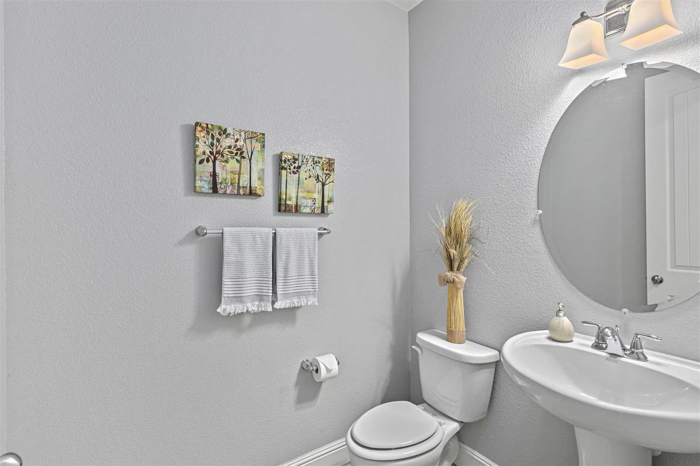 Oakland, 94605 - Photo 29 of 61 a white toilet sitting next to a bathroom sink