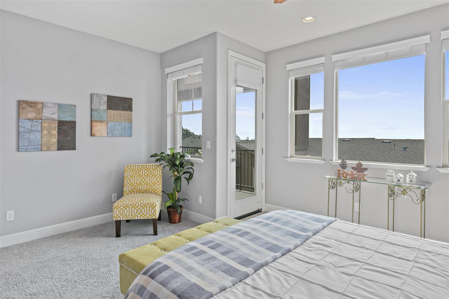 Oakland, 94605 - Photo 35 of 61 a bedroom with a bed and a chair