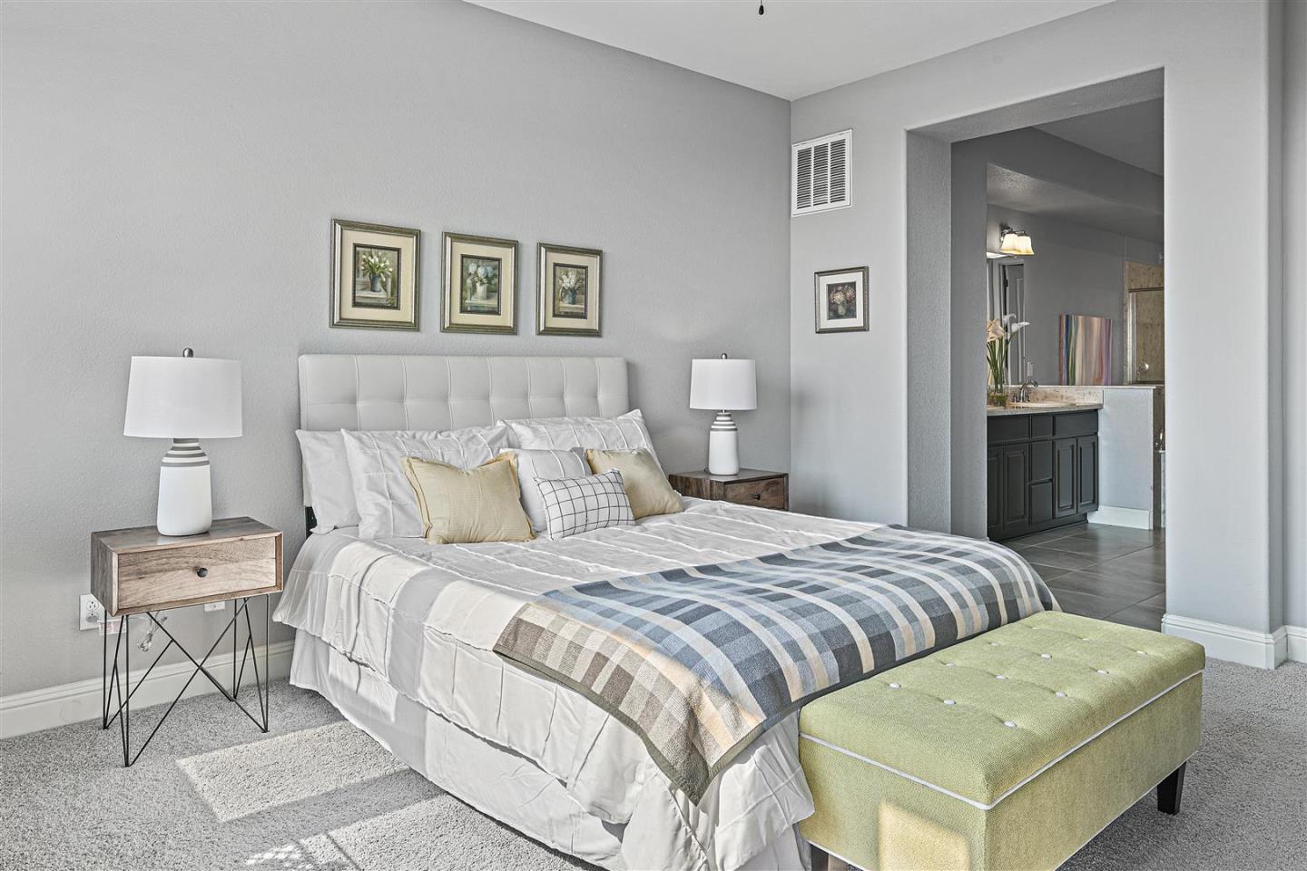 Oakland, 94605 - Photo 38 of 61 a bedroom with a bed and a lamp