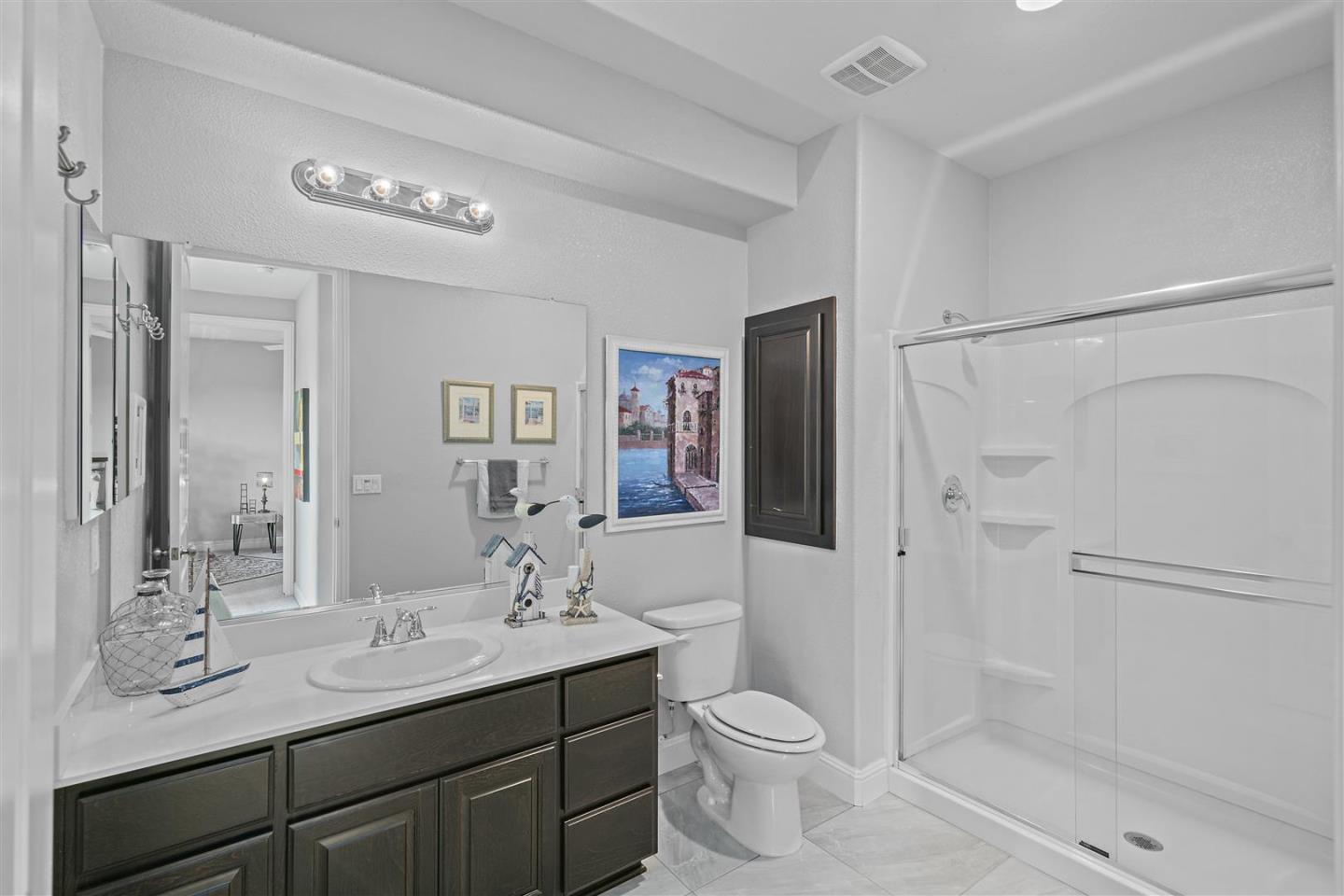 Oakland, 94605 - Photo 52 of 61 a bathroom with a toilet a sink and shower