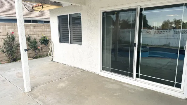 a view of a glass door of the house