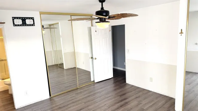 a view of an entryway with wooden floor