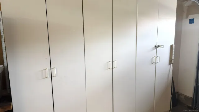 a view of a livingroom with furniture and a kitchen