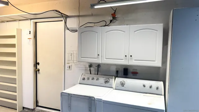 a view of a room with wooden floor and window