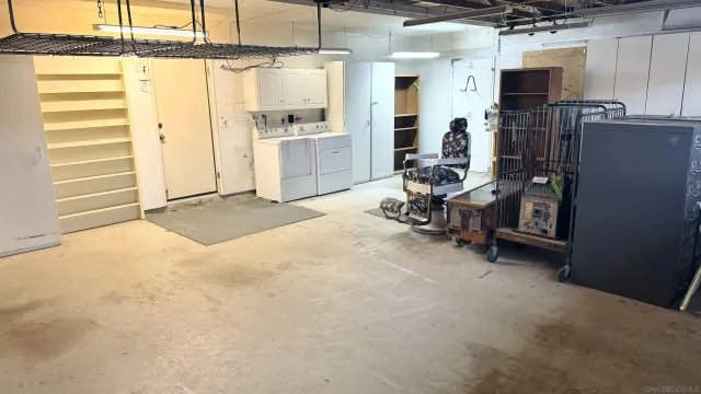 a view of a room with wooden floor and chandelier