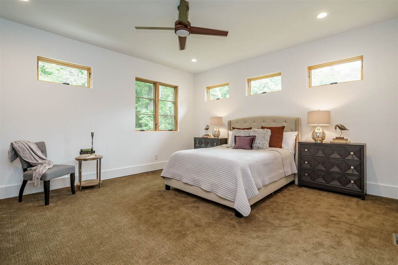 1619 Lorraine Road Raleigh, NC 27607 - Photo 16 of 30 Large Owner's Suite is located at the back at the home off the tranquil backyard. This large Bedroom offers plenty of space for large furniture. Custom windows were placed for maximum privacy. Stainmaster carpet makes the room cozy and extra quiet. Owner's Suite / Bedroom
