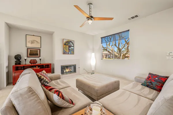 a living room with furniture and a large window