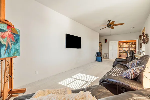 a bedroom with a bed dresser and a window