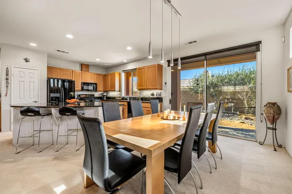 a view of a dining room with furniture window and outside view
