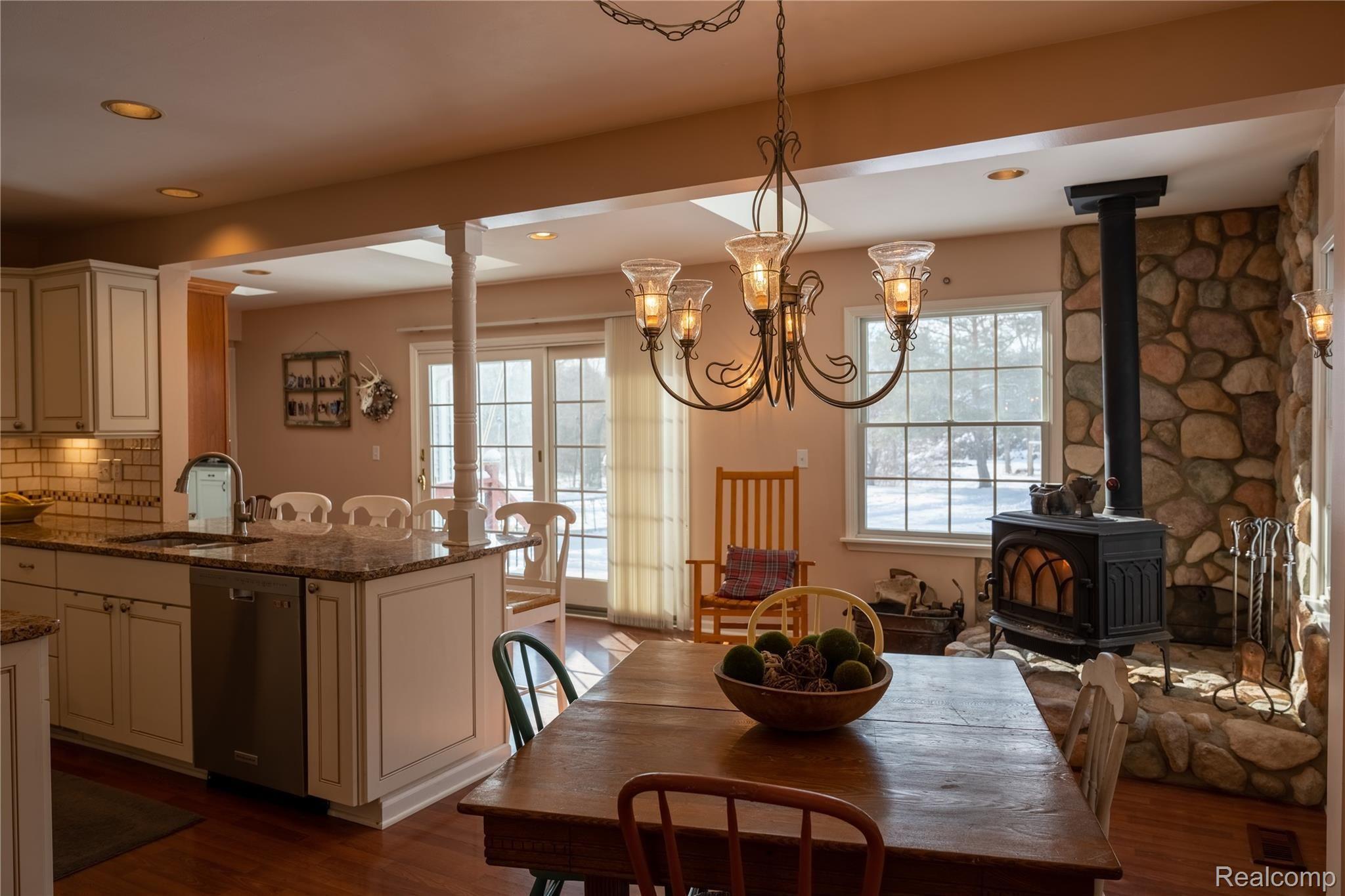 4350 South Mill Road Dryden, MI 48428 - Photo 9 of 56 Kitchen features a cozy wood burning stove