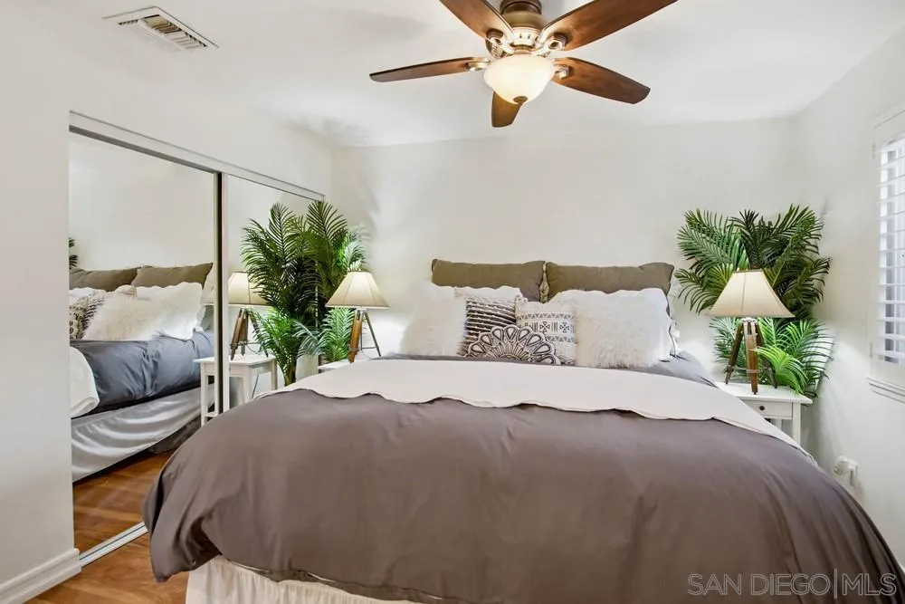 11038 Larkridge Street Santee, CA 92071 - Photo 15 of 44 a bedroom with a bed potted plant with the outer view