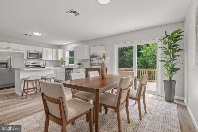 a kitchen with a refrigerator stove and sink