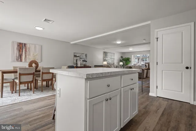 a spacious bedroom with a bed and a couch