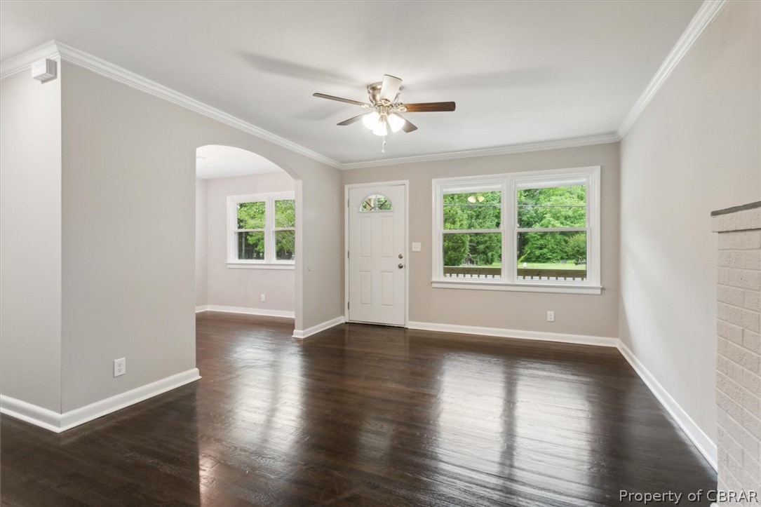 9040 Diascund Road Lanexa, VA 23089 - Photo 8 of 37 Unfurnished room featuring plenty of natural light, dark hardwood / wood-style floors, ceiling fan, and ornamental molding
