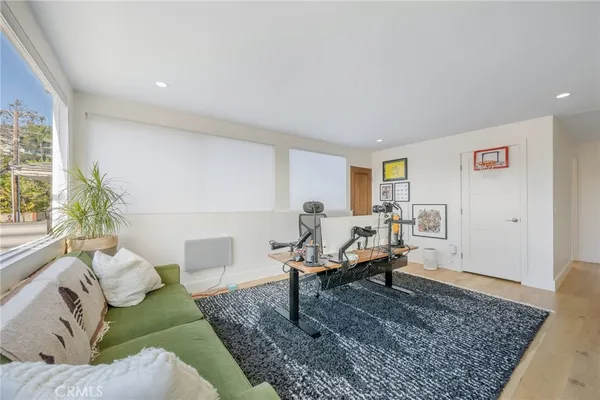 a living room with furniture and a rug