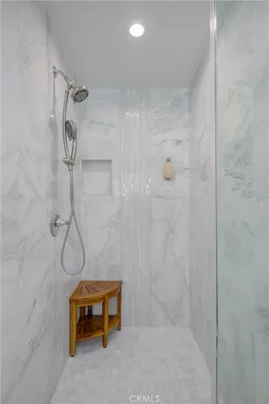a bathroom with a glass shower door