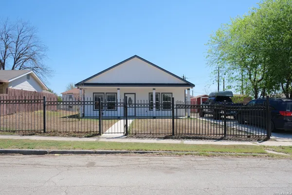 a view of a house with a fence