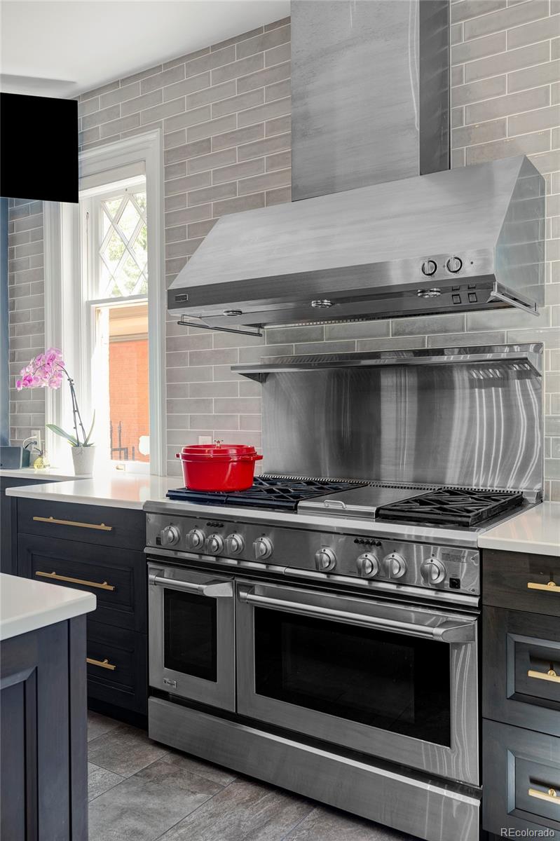 1275 Franklin Street Denver, CO 80218 - Photo 14 of 48 a stove top oven sitting inside of a kitchen
