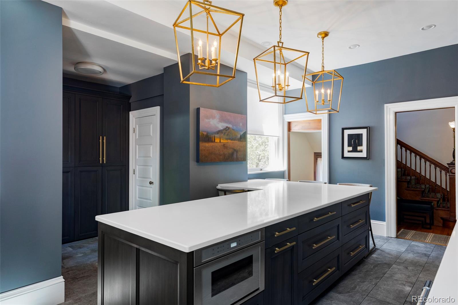 1275 Franklin Street Denver, CO 80218 - Photo 15 of 48 a kitchen with a table chairs and cabinets