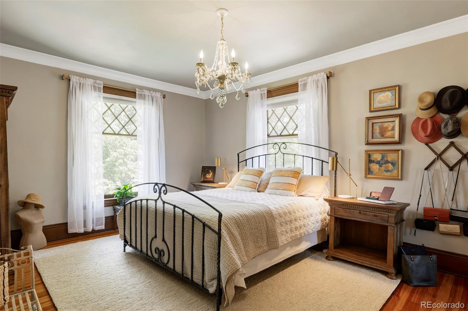 1275 Franklin Street Denver, CO 80218 - Photo 19 of 48 a bedroom with a bed and a table in it