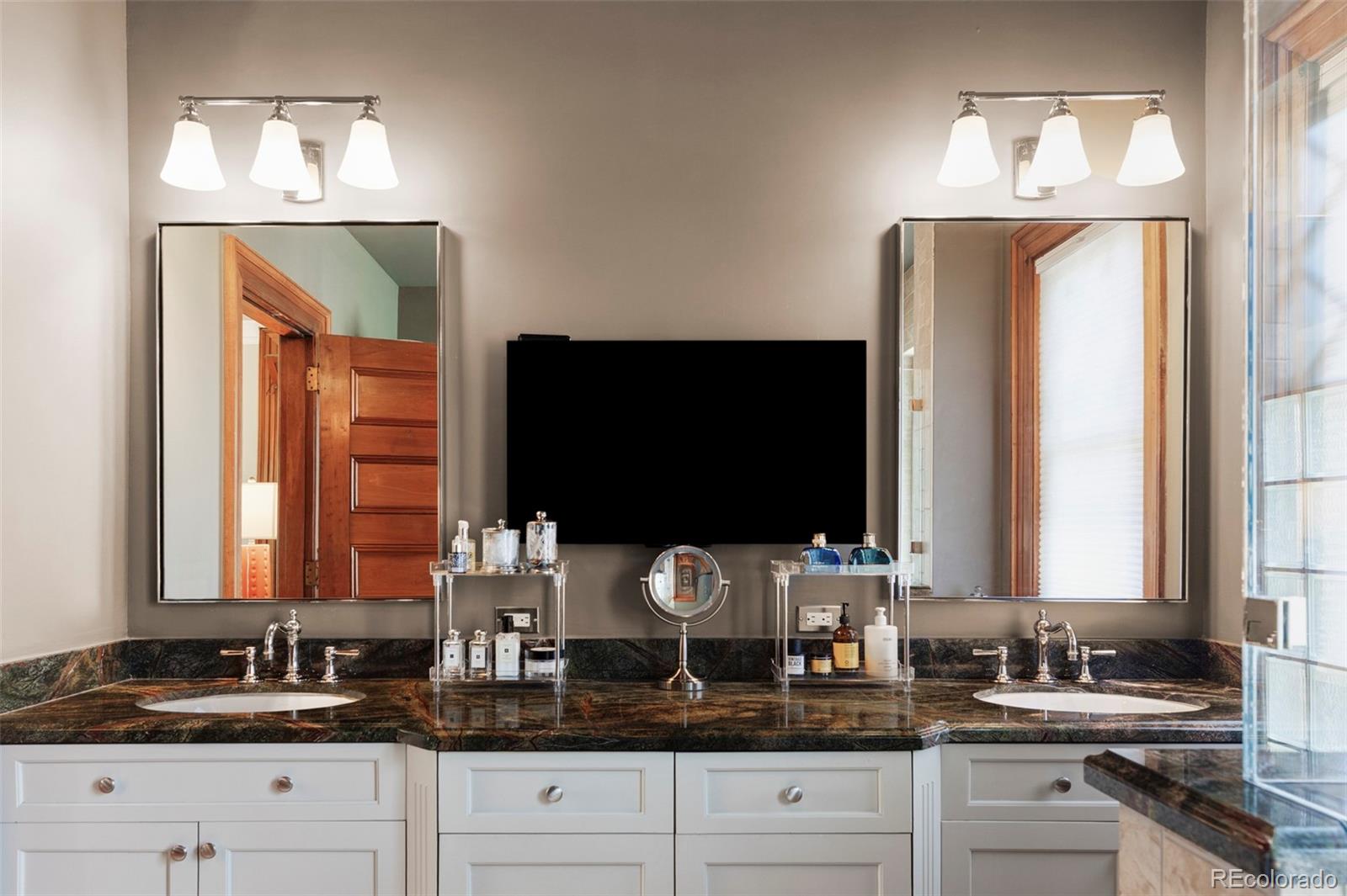 1275 Franklin Street Denver, CO 80218 - Photo 20 of 48 a bathroom with double sink and a mirror