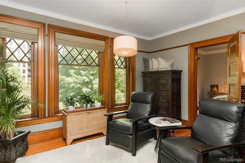 a bedroom with furniture and windows