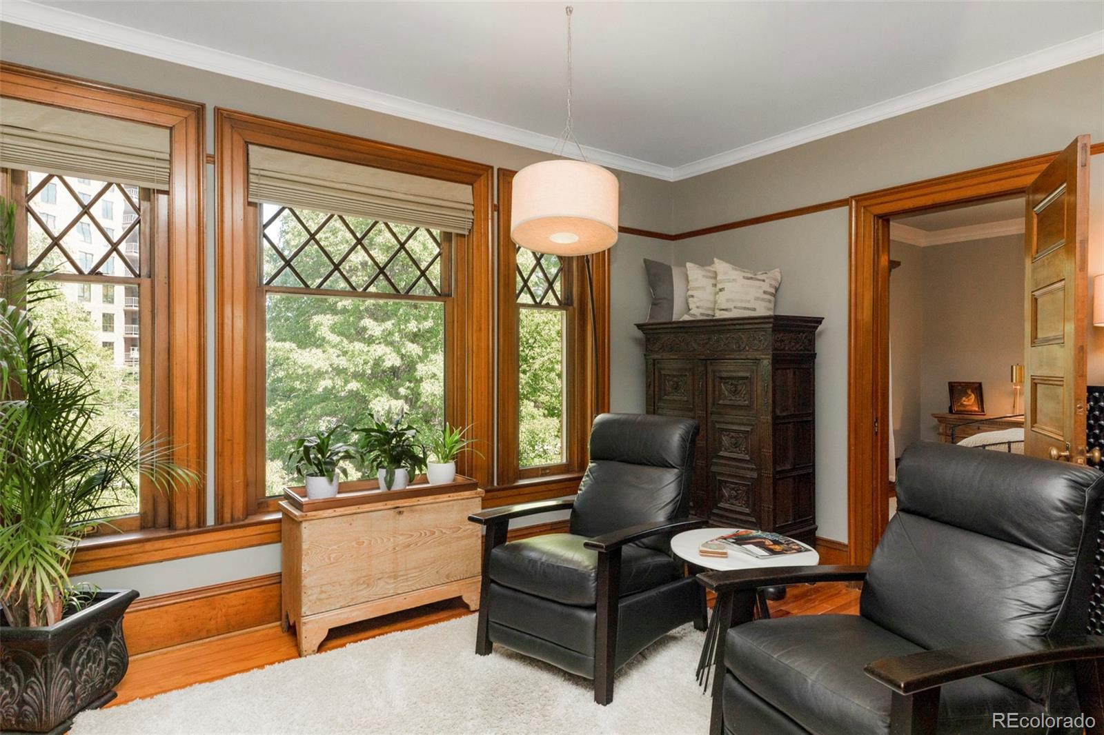 1275 Franklin Street Denver, CO 80218 - Photo 22 of 48 a living room with furniture and a large window