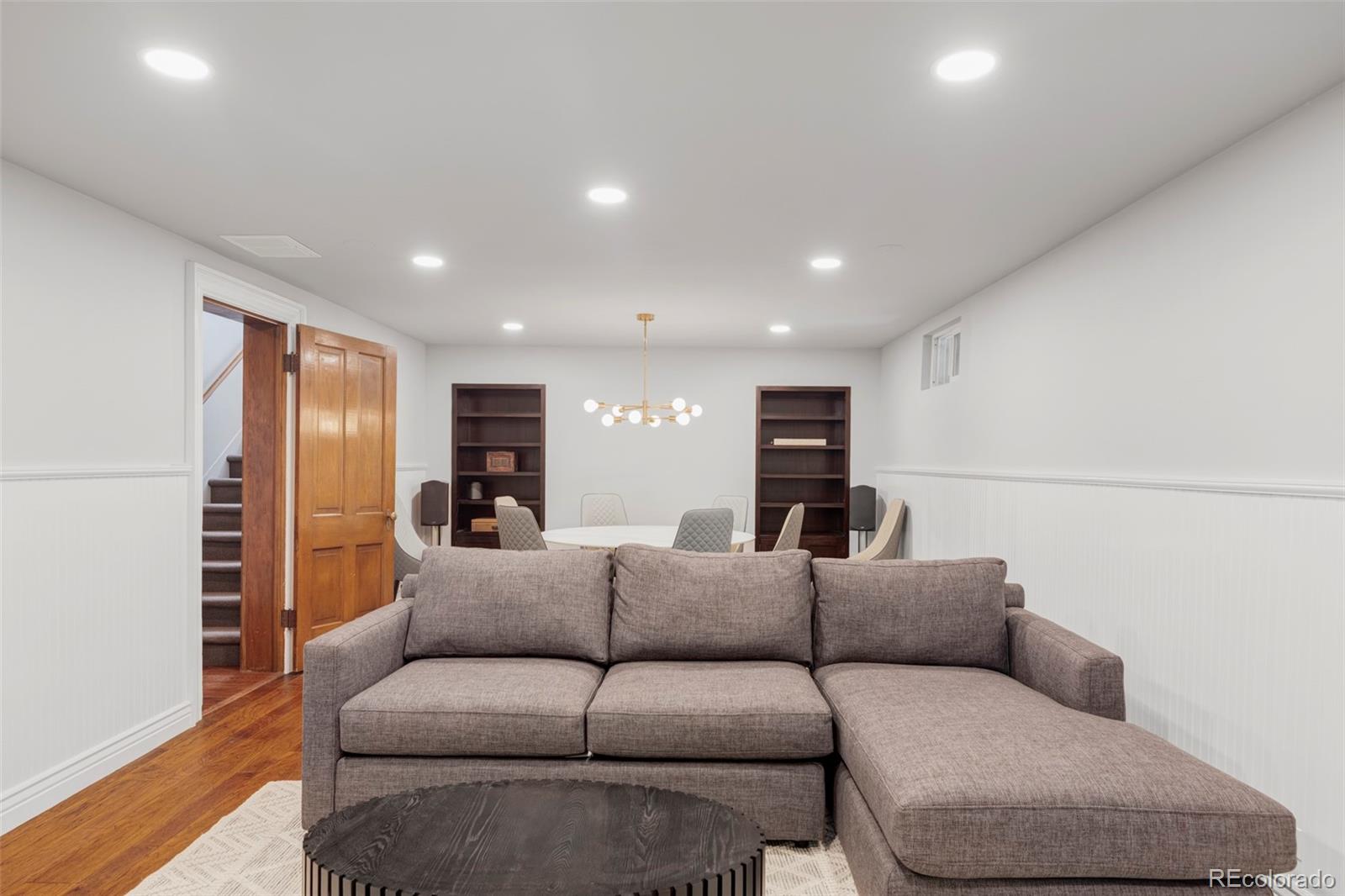 1275 Franklin Street Denver, CO 80218 - Photo 32 of 48 a living room with furniture and a flat screen tv