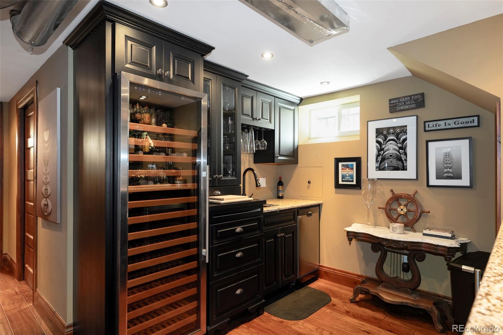 1275 Franklin Street Denver, CO 80218 - Photo 35 of 48 a kitchen with stainless steel appliances a sink and cabinets