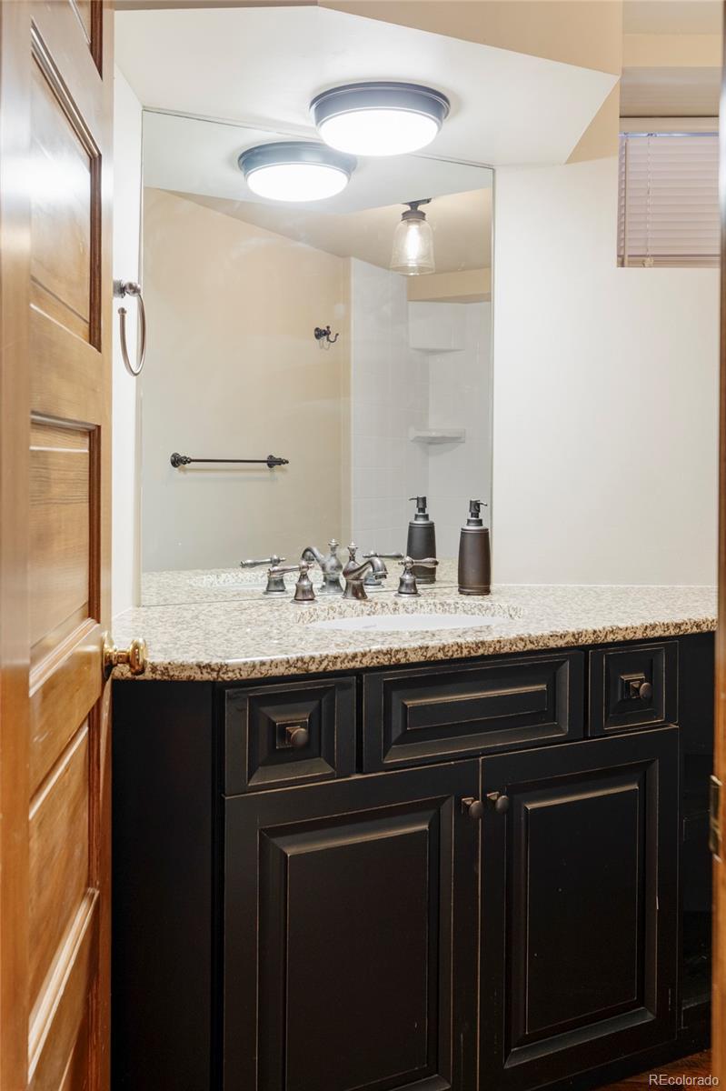 1275 Franklin Street Denver, CO 80218 - Photo 37 of 48 a sink and a mirror