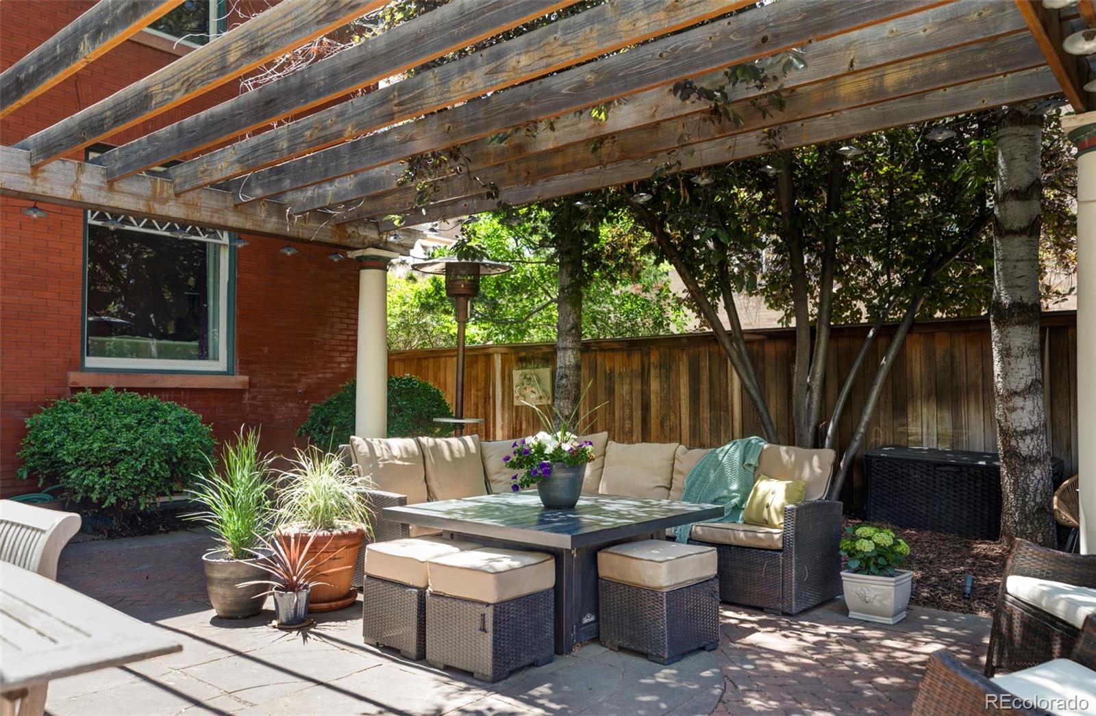 1275 Franklin Street Denver, CO 80218 - Photo 42 of 48 a view of a patio with couches chairs and a potted plant