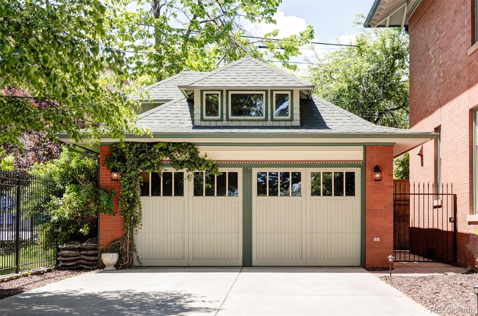 1275 Franklin Street Denver, CO 80218 - Photo 43 of 48 a front view of a house with a blue gate