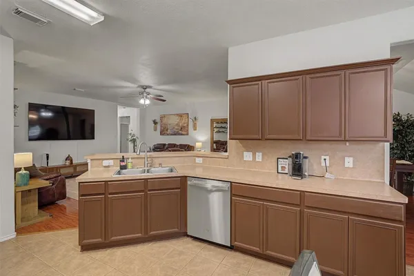 a kitchen with a sink and cabinets