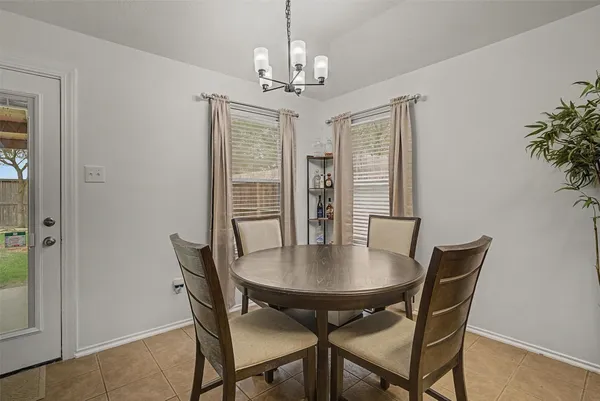 a view of a dining room with furniture and window