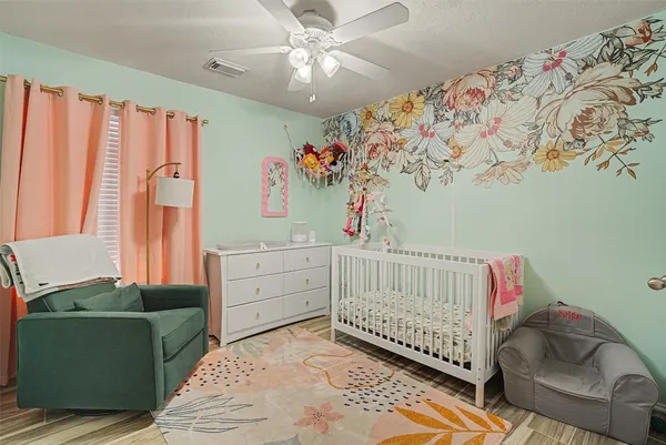 a bedroom with furniture and a window
