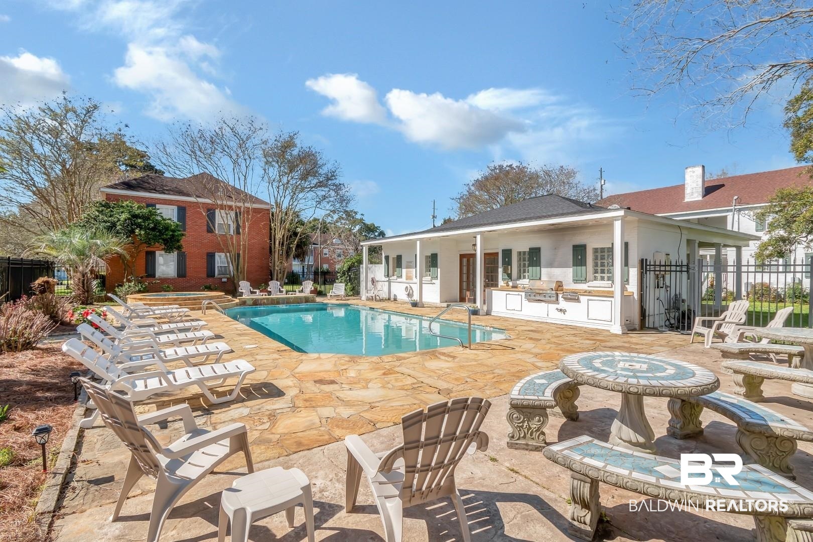 214 Upham Street, Unit 4A Mobile, AL 36607 - Photo 4 of 23 Pool featuring an outbuilding, exterior kitchen, a patio, and fence