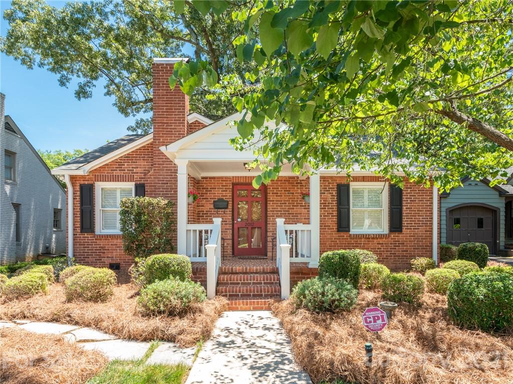 2012 Club Road Charlotte, NC 28205 - Photo 2 of 41 a front view of a house with garden