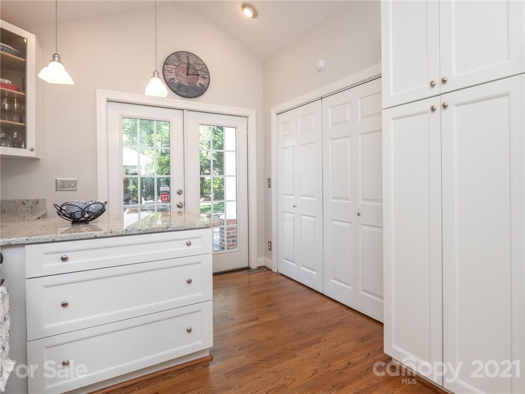 2012 Club Road Charlotte, NC 28205 - Photo 15 of 41 a bathroom with a granite countertop sink mirror vanity and a window