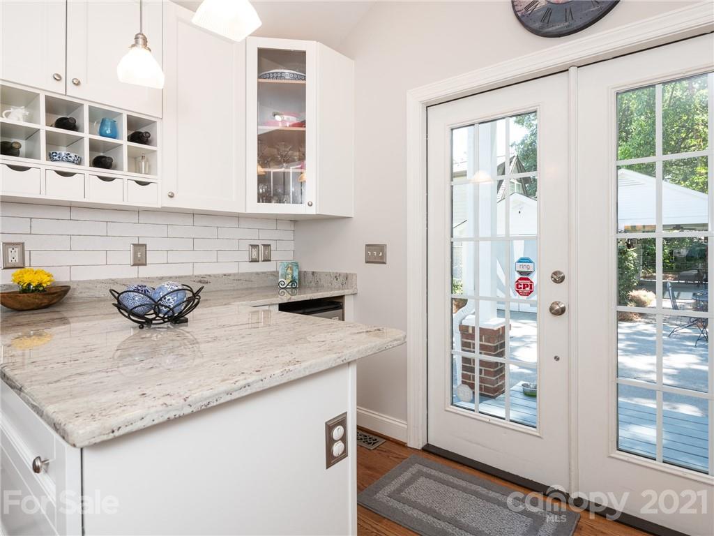 2012 Club Road Charlotte, NC 28205 - Photo 16 of 41 a kitchen with a granite countertop sink and cabinets