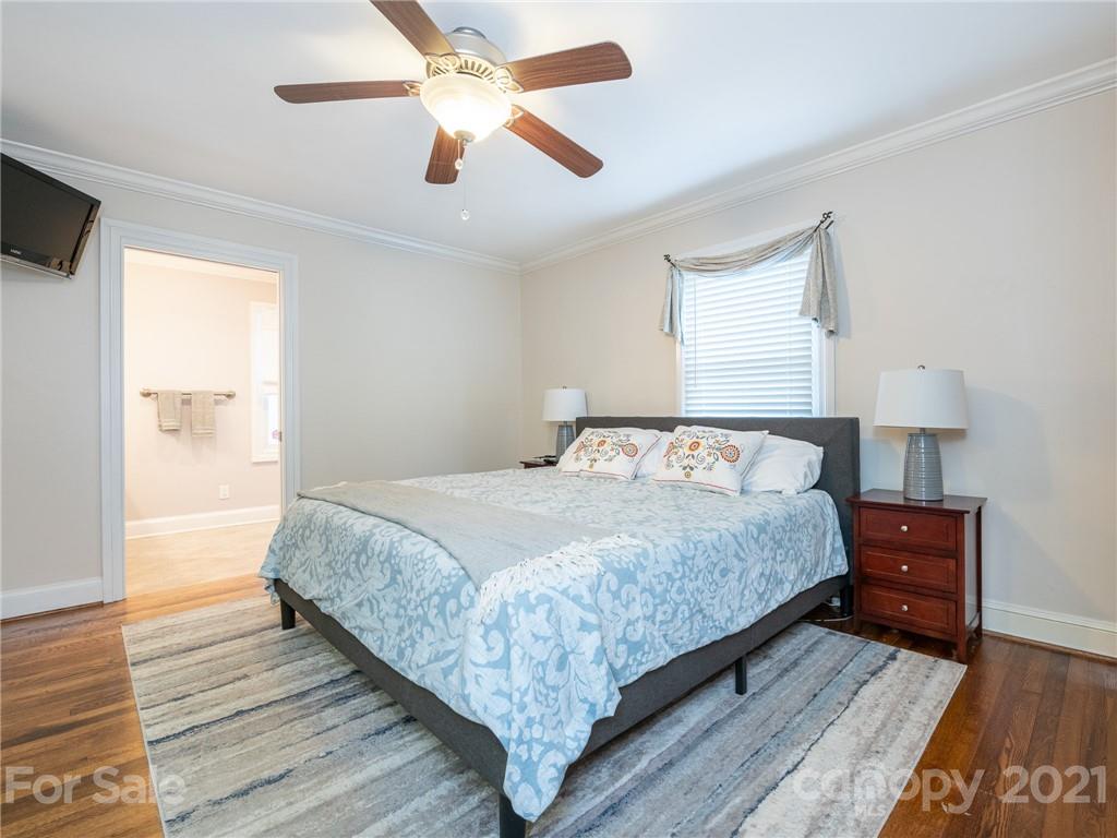 2012 Club Road Charlotte, NC 28205 - Photo 18 of 41 a bedroom with a bed and wooden floor