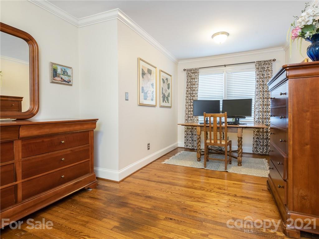 2012 Club Road Charlotte, NC 28205 - Photo 22 of 41 a room with lots of furniture and a flat screen tv