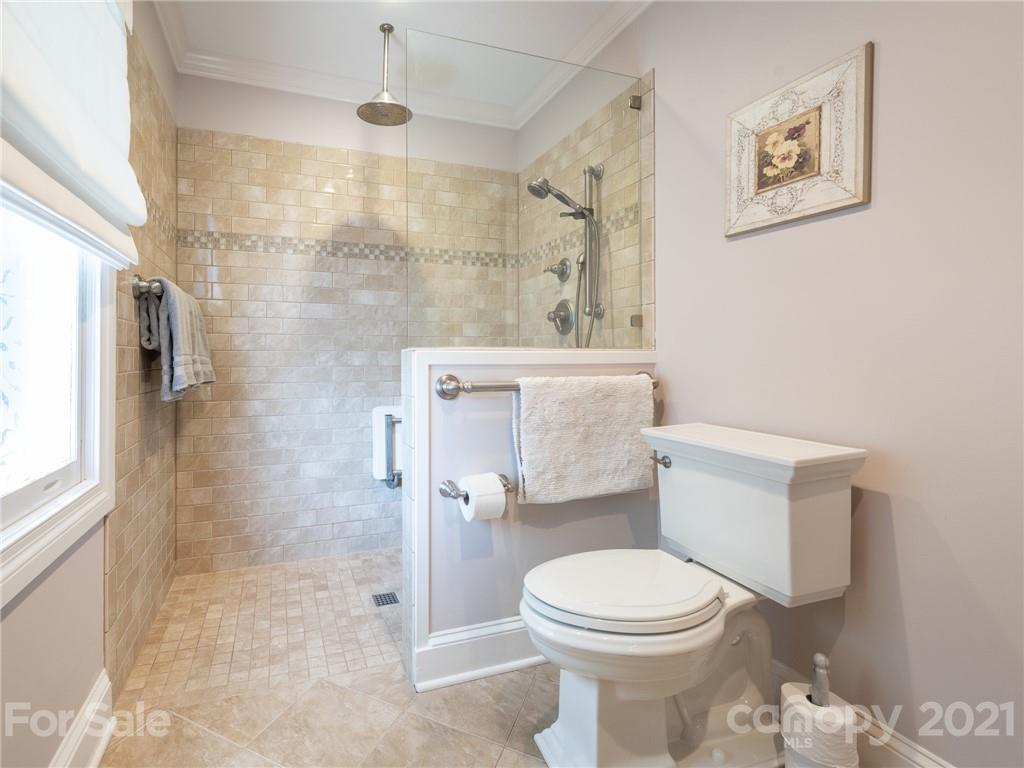 2012 Club Road Charlotte, NC 28205 - Photo 24 of 41 a bathroom with a toilet sink and shower