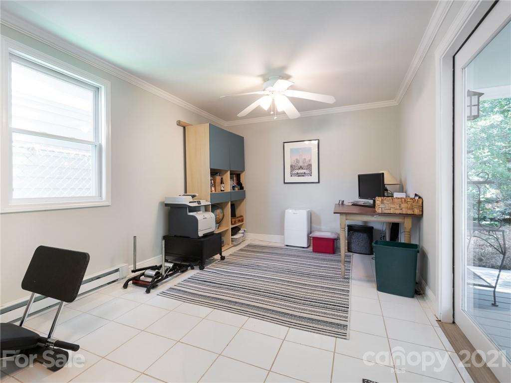 2012 Club Road Charlotte, NC 28205 - Photo 30 of 41 a bedroom with a bed and a chandelier