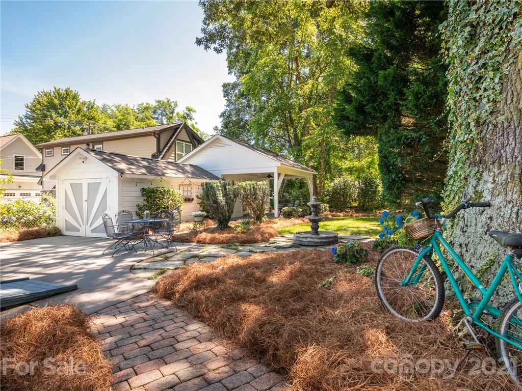 2012 Club Road Charlotte, NC 28205 - Photo 36 of 41 a view of a swimming pool with sitting area in backyard