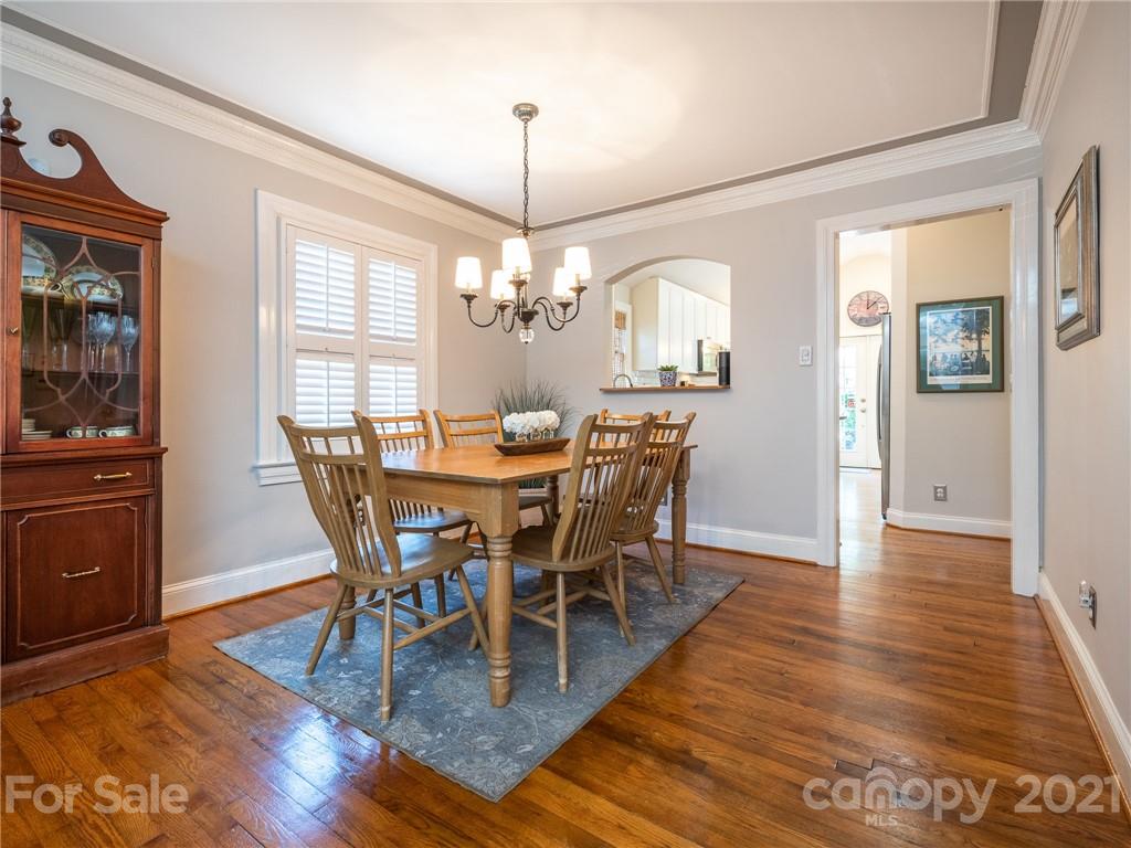 2012 Club Road Charlotte, NC 28205 - Photo 8 of 41 a view of a dining room with furniture window and wooden floor